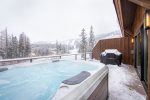 Relax together in the home`s private hot tub with slope side views.